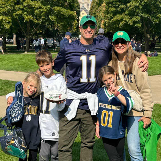 Travis McGhee's family at a football game