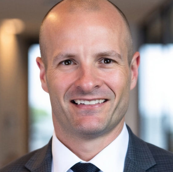 Headshot of Travis McGhee.