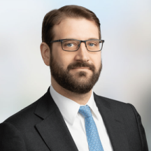 Man in a suit with glasses